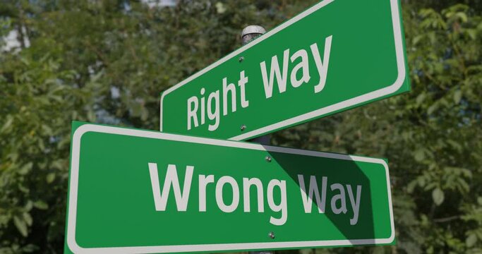 4k Pan of Right Way, Wrong Way 2 Way Green Road Sign.