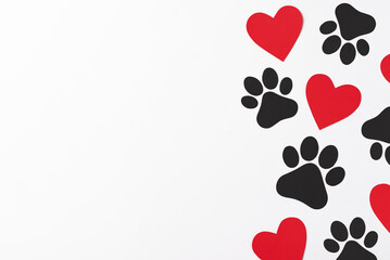 Pet paws on white background, dog paws pattern. National Puppy Day creative concept, top view