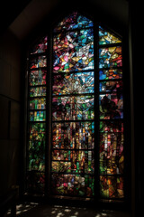 Fototapeta na wymiar colorful sacred stained glass windows in the church, generative AI