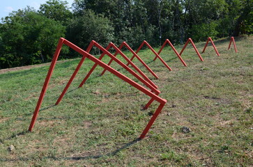 red geometric sculpture in the meadow