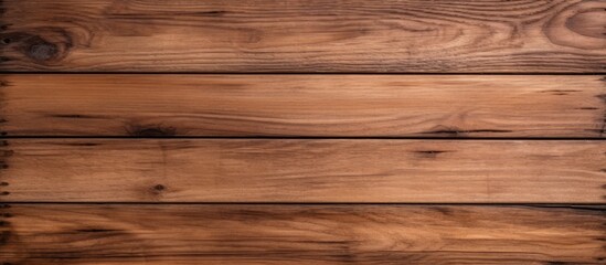 Naklejka premium A closeup of a brown hardwood table with a smooth amber wood stain, showcasing the natural beauty of the wood grain and texture