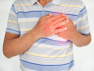 Asian man having severe chest pain as heart attack and illness concept on white background. closeup...