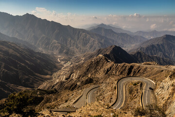 View of Wadi Hali in Al Souda mountains with a winding road near Abha, Saudi Arabia