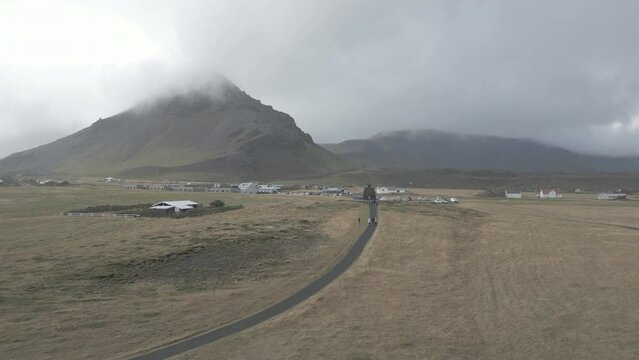 Discover the breathtaking beauty of the Arnarstapi Cliff landscape in Iceland. This stunning coastal scene features dramatic cliffs overlooking the vast Atlantic Ocean, with rugged rock formations and