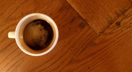 demitasse of black espresso - (doppio nero espresso) on the dining room table     