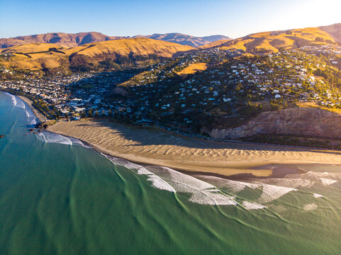 aerial panorama of christchurch city, new brighton beach, southshore and sumner beach at sunset;	