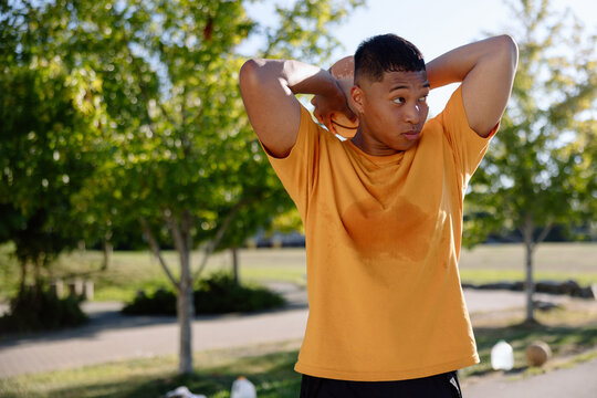 Sweaty basketball player looking to the side.