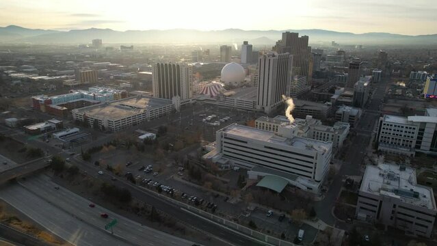 RENO - 2.22.2024 - Excellent aerial footage approaching downtown Reno, Nevada at the start of sunset.