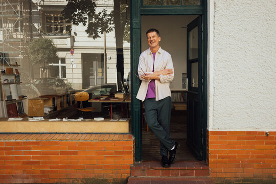 Man posing at office door