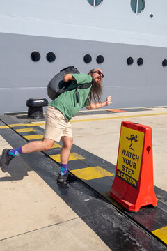 Imitating safety sign next to cruise ship