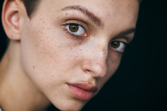 Beauty Portrait of young woman with perfect skin looking at camera