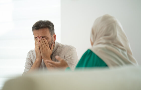 Strssed Husband Talking to a Couple's Therapist