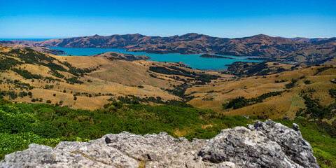 panorama of banks peninsula and akaroa harbour as seen from the top of the hill in otepatotu scenic reserve; canterbury, new zealand south island near christchurch