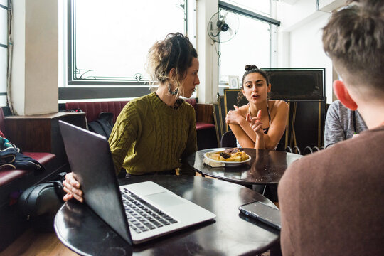 Employee giving feedback in staff meeting