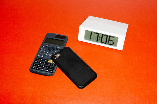 Contemporary photo of office table with smartphone and calculator