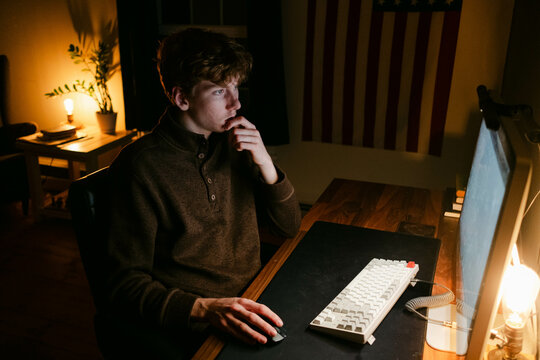 young student  working on computer late