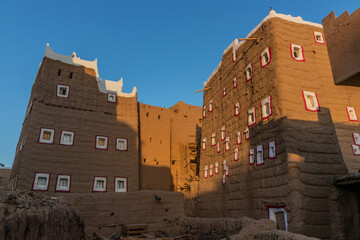 Old mud-brick houses in Dhahran al Janub, Saudi Arabia - obrazy, fototapety, plakaty