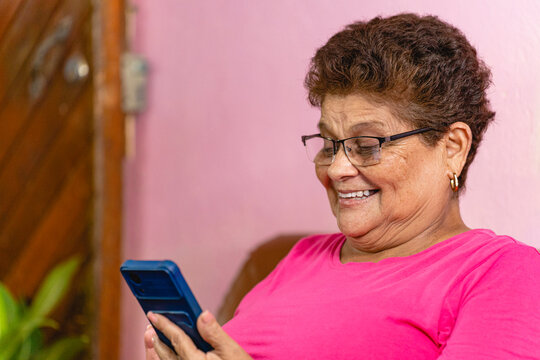 Elderly woman using her cell phone.