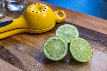 lemon and lime on wooden table