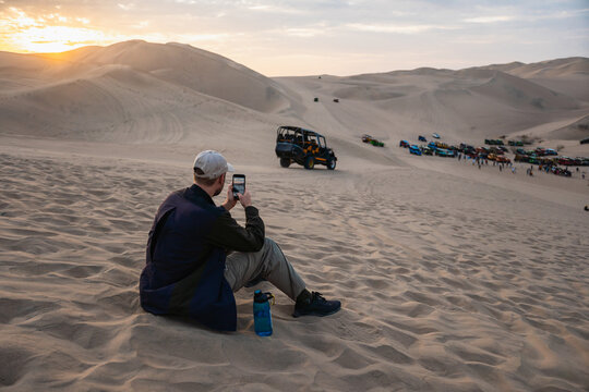 Man taking photos in the desert