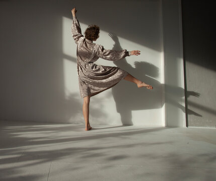 Girl is dancing in the sunlight