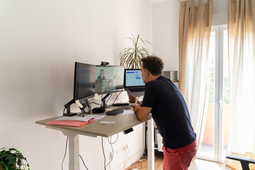 Man Attending Online Business Meeting At Home