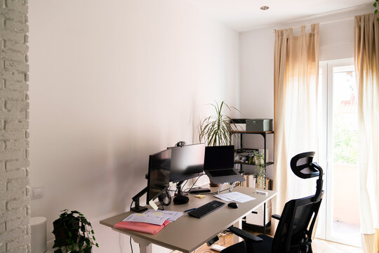 Table With Computers And Documents In Home Office