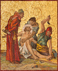 MILAN, ITALY - MARCH 4, 2024: The mosaic Jesus is nailed to the cross as part of Cross way station in the church Chiesa di San Agostino by unknown artist of 20. cent. - 759320670