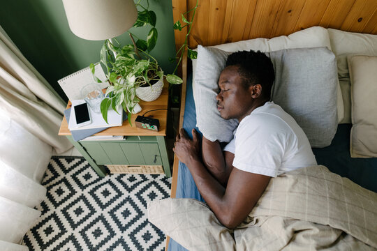 A sleeping man in the bed