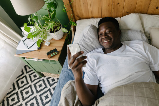 A man with a phone in the morning