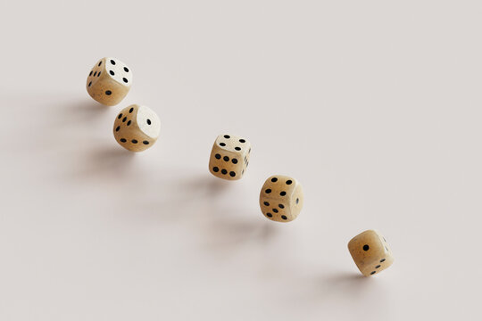 dices on a pink background with copy space