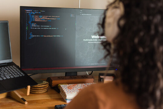 Smart woman coding - Powered by Adobe