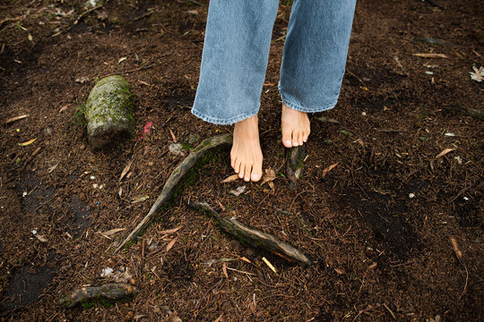 Feet of anonymous woman on the ground