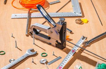 scattered staple gun and tools