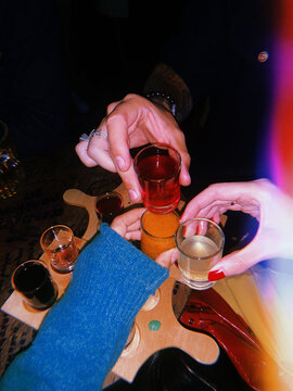 Testing different types of alcohol shots in bar 