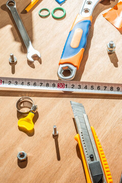 scattered tools on wooden surface.