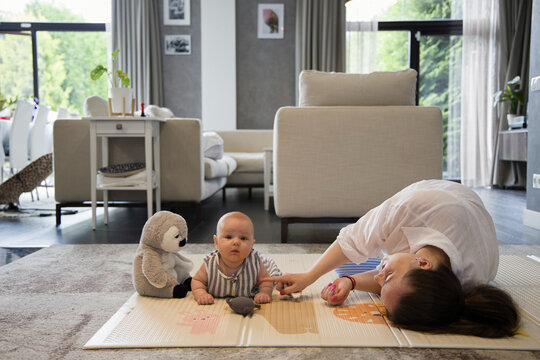 Woman with a baby on a floor