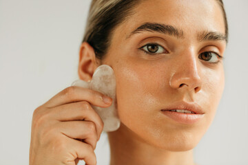 Woman Massaging Face