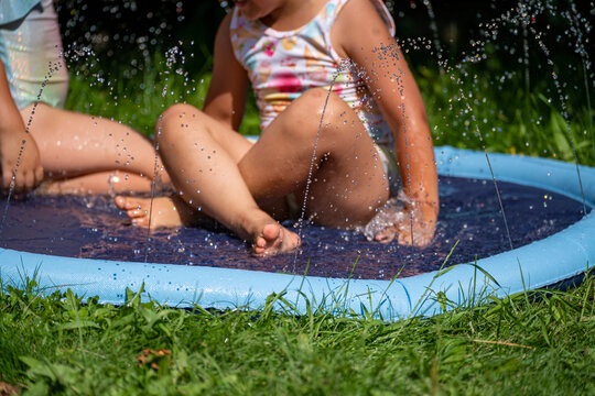 two little girl playing water