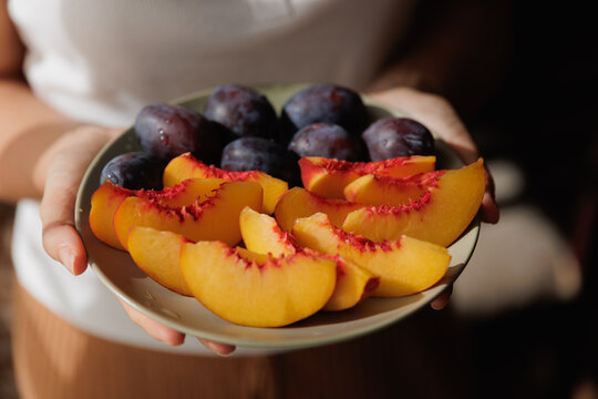 Sliced peaches and plums