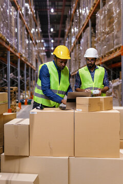 Storage service colleagues busy. Digital laptop data entering
