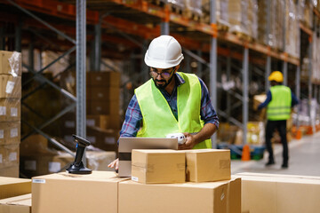 Foreign warehouse worker team processing goods information 