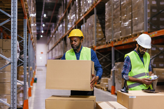 Workers stacking boxes