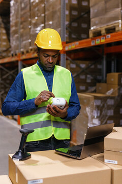 Box packaging company staff multicultural worker. Counting goods 