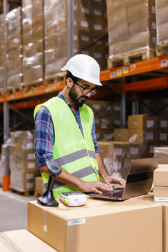 Warehouse worker using computer