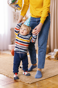 Birthday boy celebration attribute anonymous caregiver 