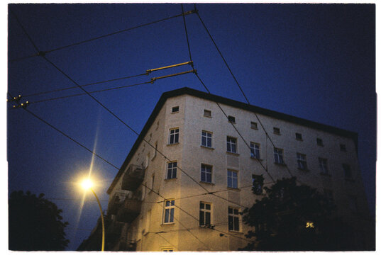 Blockwide corner building with a lot of windows at night