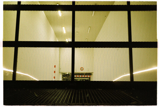 Parking entrance: view from behind black metal guardrail in Berlin