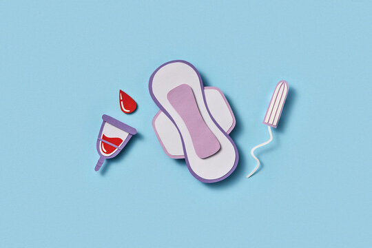 Papercraft composition of menstrual cup, sanitary pad and tampon