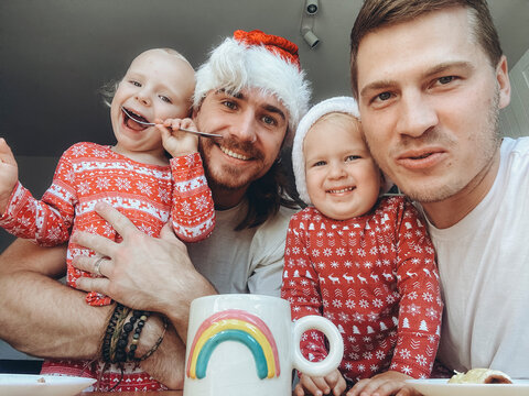 UGC Selfie Of A LGBT happy family with kids at christmas time. 